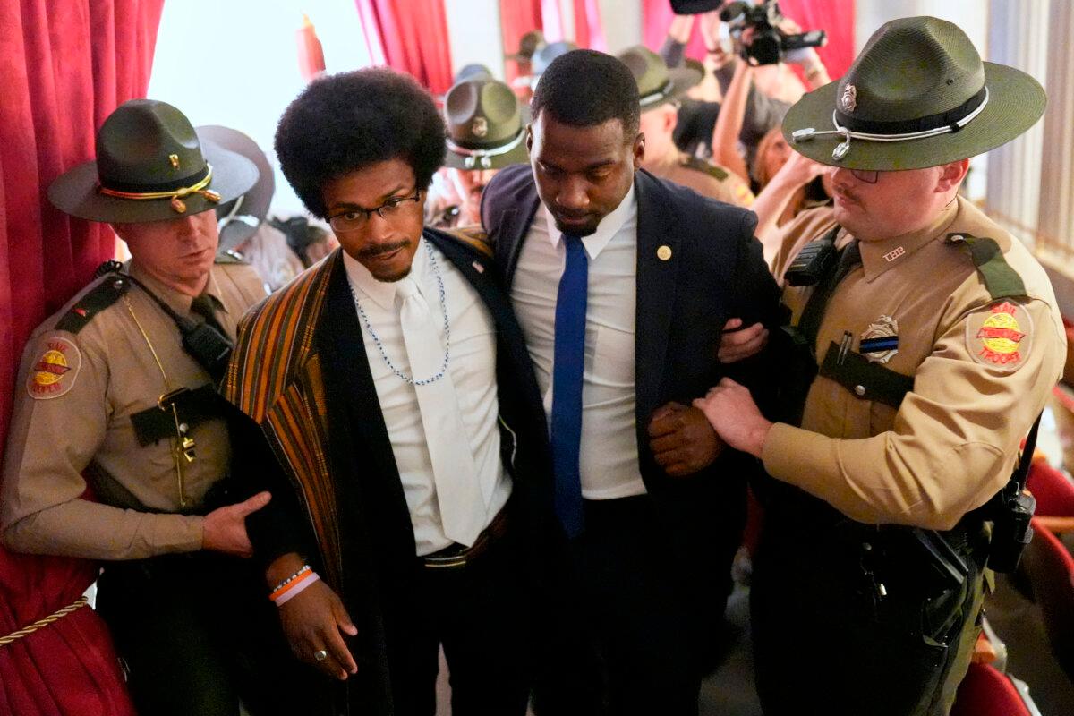 State Rep. Justin J. Pearson (2nd L), a Democrat representing Memphis, walks with his brother KeShaun Pearson (2nd R), who is being arrested and removed from the House gallery during a special session of the state legislature to redraw U.S. congressional voting maps in Nashville on May 7, 2026. (George Walker IV/AP Photo)