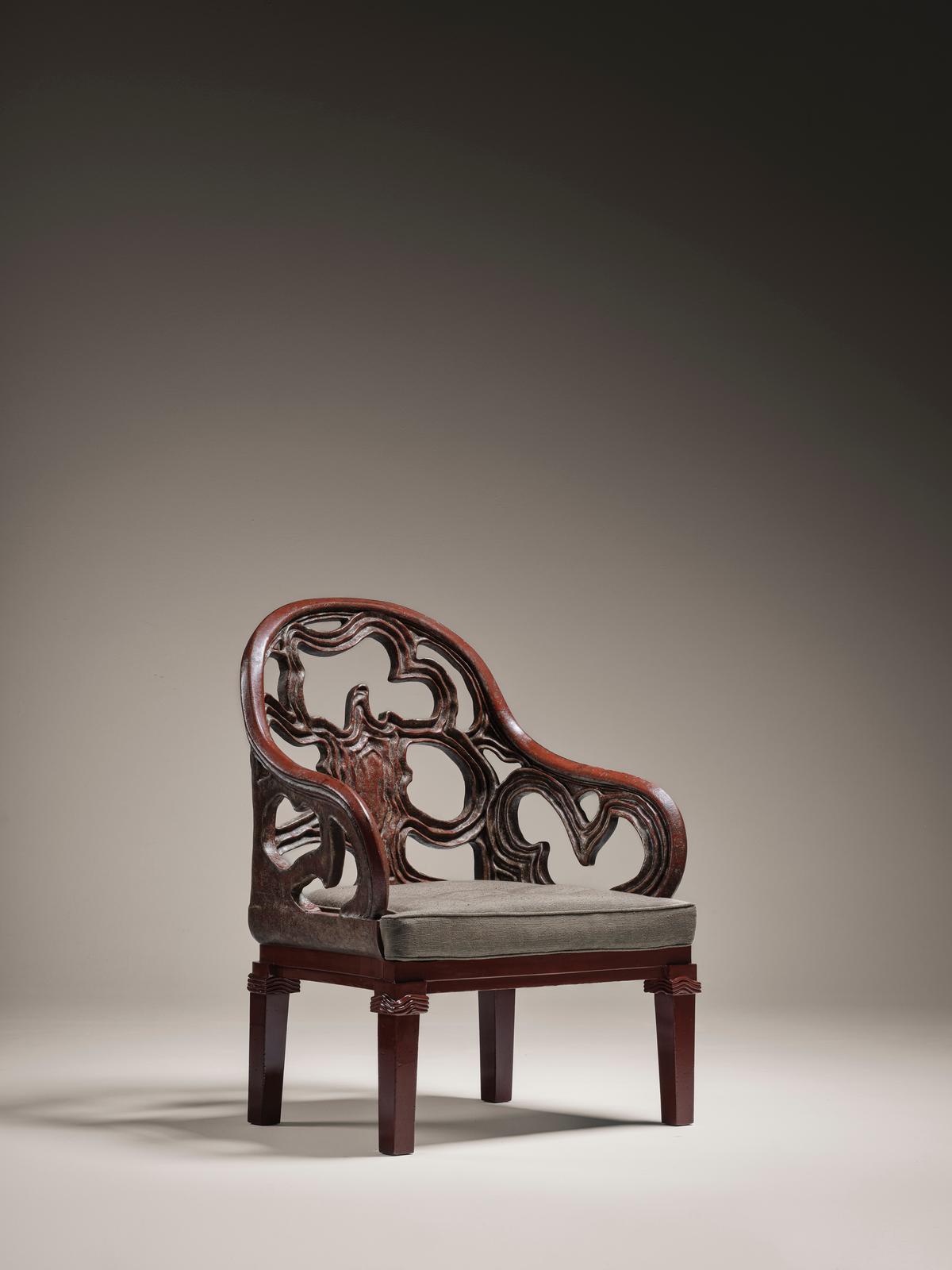 “The Ardent Armchair,” circa 1915, by Seizo Sugawara. Lacquered wood, solid wood, silver powder; 36 11/16 inches by 28 13/16 inches by 24 9/16 inches. (Cecil Mathieu/Galerie Marcilhac)