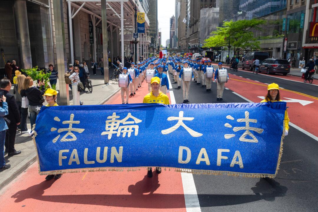 Day in Photos: Falun Dafa Day, Mayor Acting as Agent for China, and National Police Week