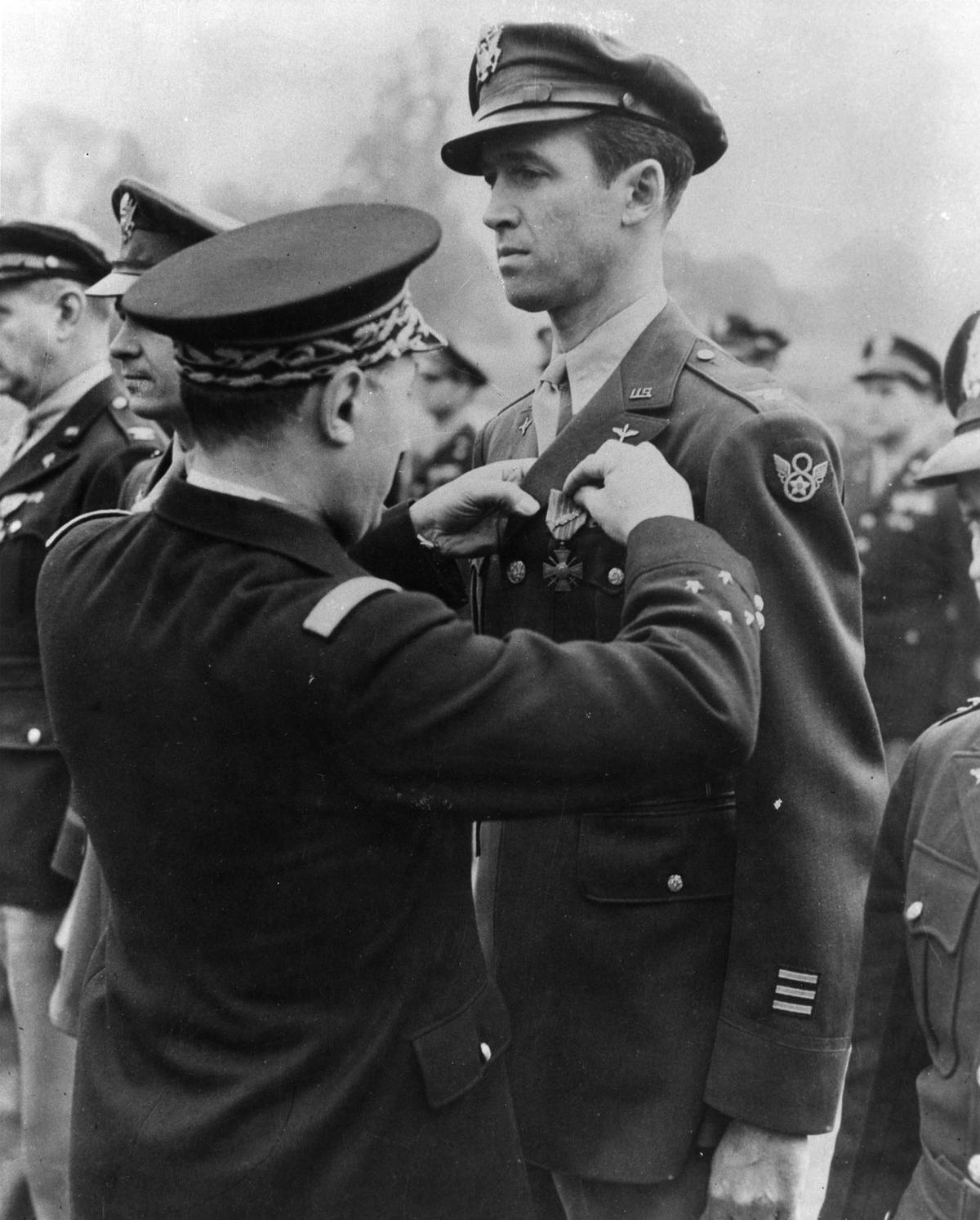 Lt. Gen. Henri Valin, Chief of Staff of the French Air Force, awards Col. Jimmy Stewart the Croix de Guerre with bronze palm (the highest degree of this award) for his exceptional services in the liberation of France, circa 1945. (U.S. Air Force photo)