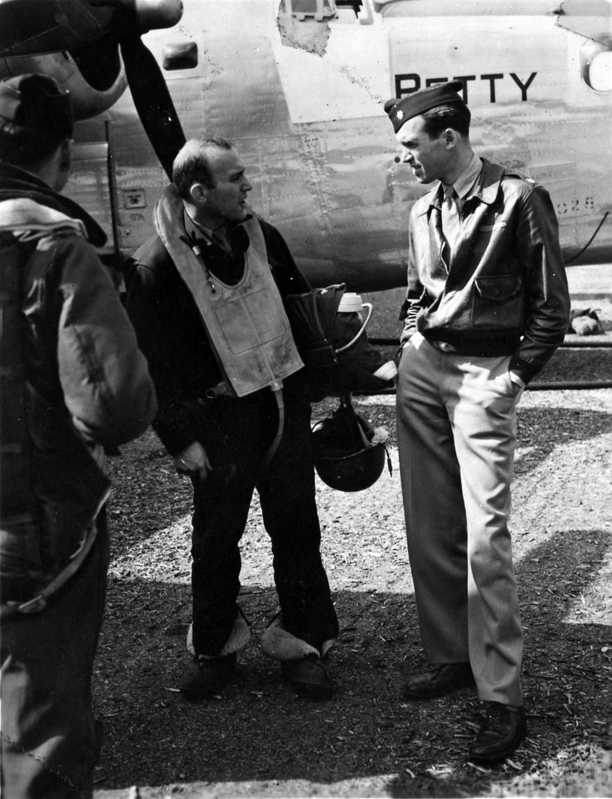 Maj. Jimmy Stewart confers with a B-24 crew member, 1944. (U.S. Air Force photo)