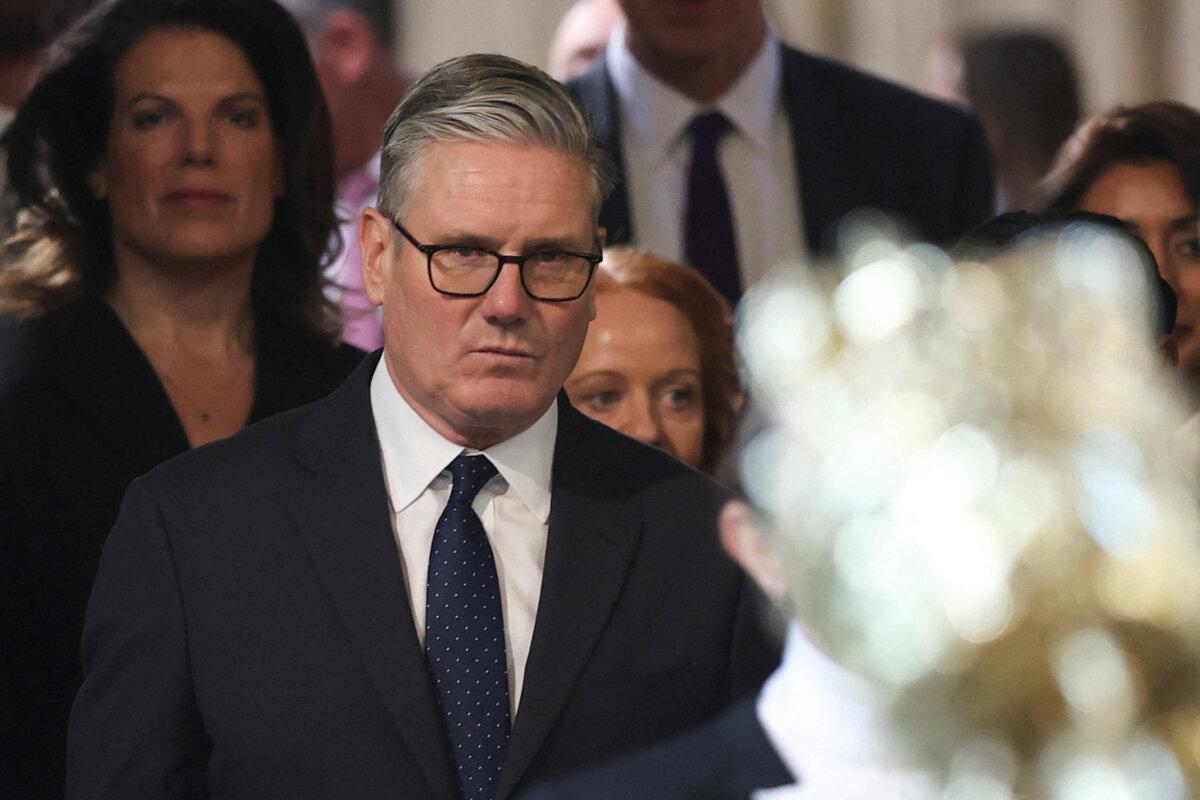 British Prime Minister Keir Starmer (C) walks through the House of Commons to attend the State Opening of Parliament at the Palace of Westminster, London, on May 13, 2026. (Toby Melville/AP)