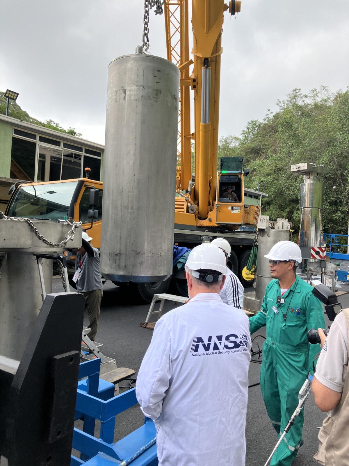 National Nuclear Security Administration technical experts oversee the loading of nuclear fuel into the specialized spent nuclear fuel cask in Venezuela as part of a special operation to remove the dangerous material in April 2026. (NNSA)