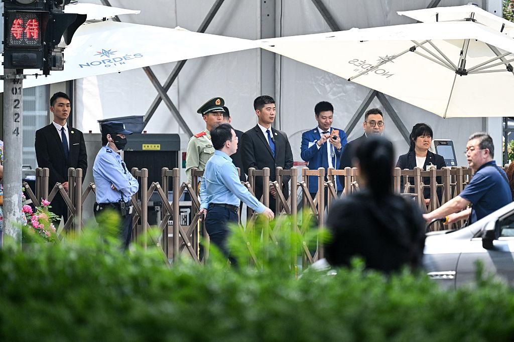 Police and security guards are seen around the perimeter of a hotel where U.S. President Donald Trump is set to stay in Beijing, ahead of the U.S. leader's arrival, on May 13, 2026. (Hector Retamal/AFP via Getty Images)