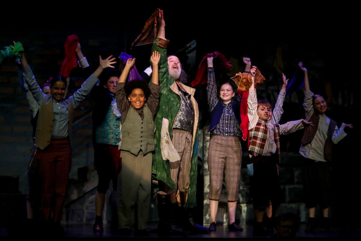 The vibrant cast of "Lionel Bart's Oliver!" lights up the stage in a heartwarming performance filled with hope and harmony. (Courtesy of Music on Stage)