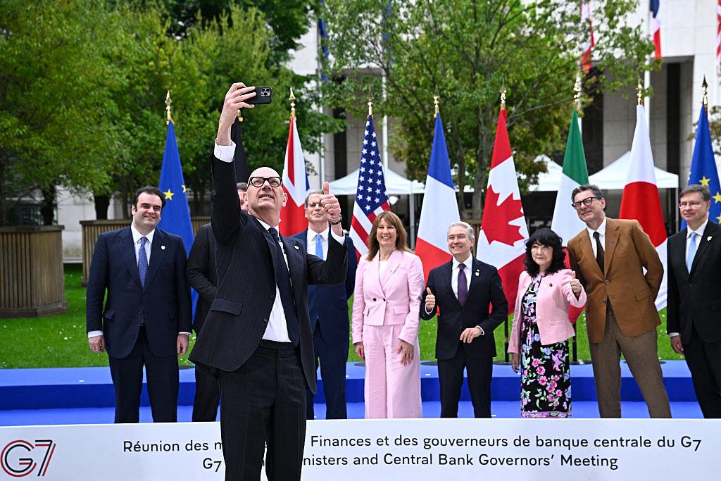 French Economy, Finances,  and Industry Minister Roland Lescure takes a photo with G7 finance ministers and central bank governors in Paris on May 18, 2026. (Julien De Rosa/AFP via Getty Images)