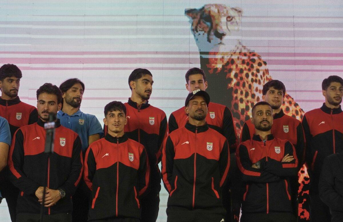 Players from Iran's national soccer team stand onstage as they are greeted by a crowd—before their departure for training and friendly matches in Turkey—at Islamic Revolution Square in Tehran, Iran, on May 13, 2026. (Vahid Salemi/AP)