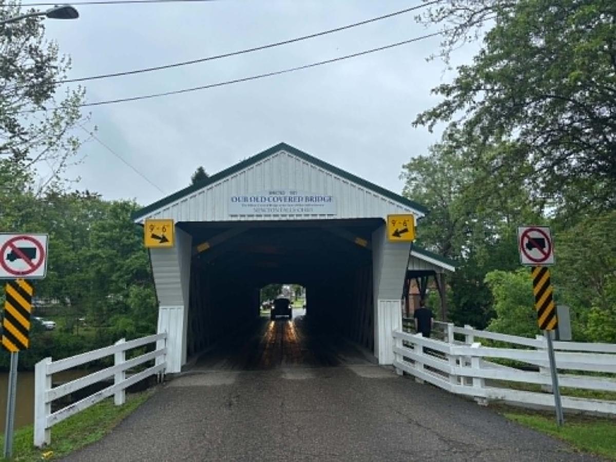 A truck heads into the Newton Falls, Ohio, covered bridge on May 24, 2026. (Jeff Louderback/The Epoch Times)