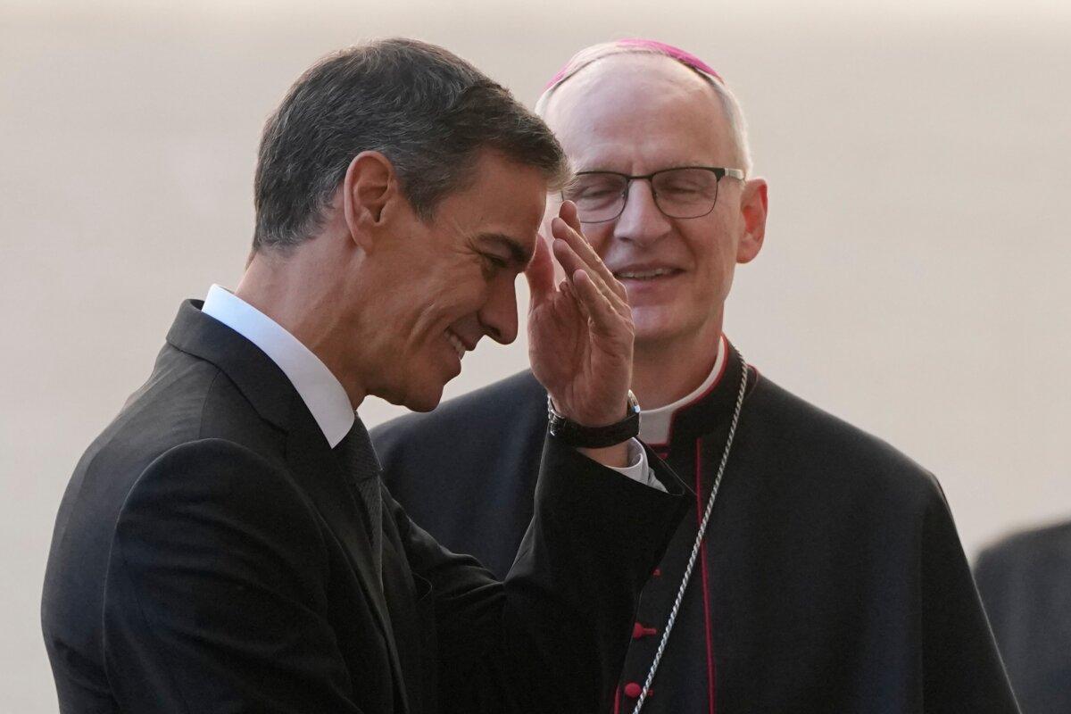 Spanish Prime Minister Pedro Sanchez is welcomed by Archbishop Petar Rajic as he arrives at the St. Damasus courtyard ahead of a private audience with Pope Leo XIV at the Vatican, on May 27, 2026. (Alessandra Tarantino/AP)