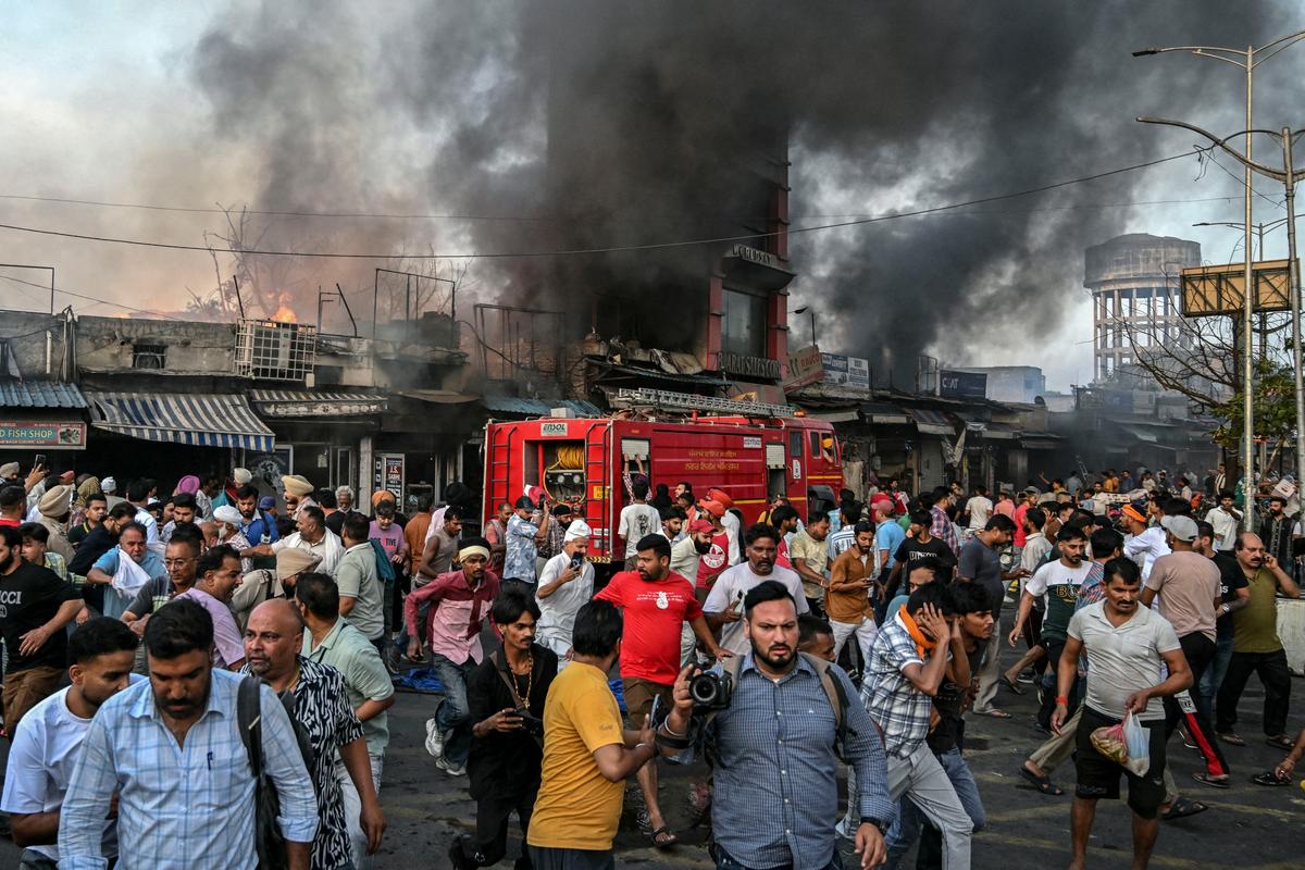 Day in Photos: Market Fire in India, Air Force Graduation, and Armenia’s Republic Day