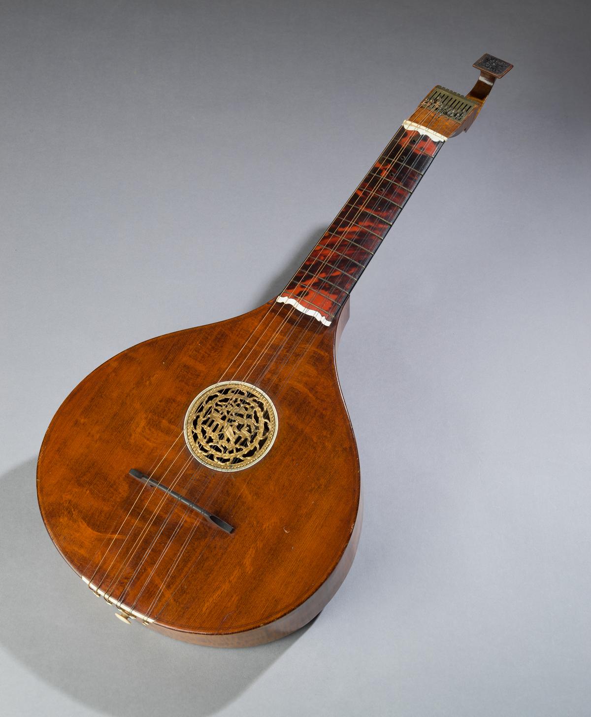 Guitar, 1765–1775, by J. N. Preston. Spruce, maple, ebony, tortoiseshell and ivory, brass, ivory, resin; 26 3/4 inches by 11 1/2 inches by 3 3/4 inches. (The Colonial Williamsburg Foundation)