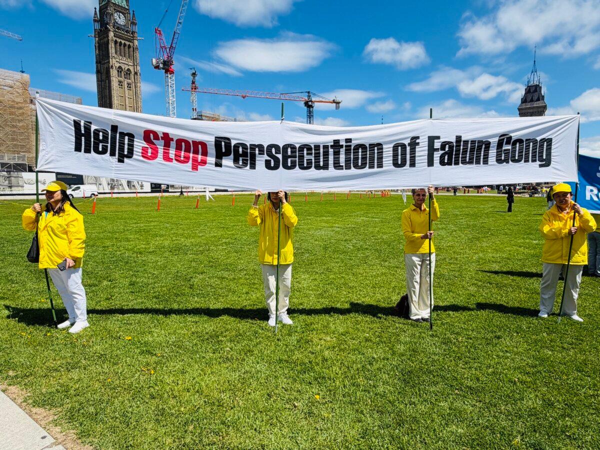 Falun Gong practitioners call for an end to the persecution campaign against their practice in China, on Parliament Hill in Ottawa on May 28, 2026. (The Epoch Times)