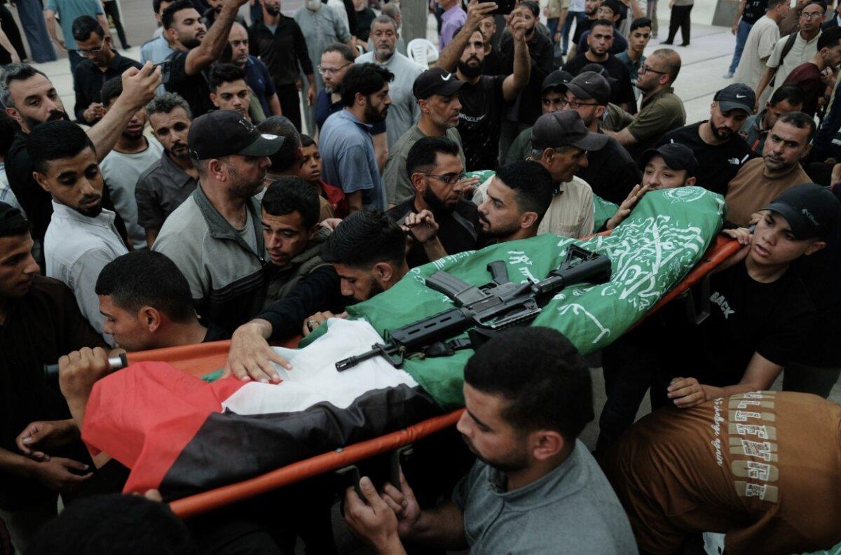 Palestinians carry the body of Hamas terrorist Imad al-Salem, who was killed in an Israeli military strike, during his funeral in Gaza City on May 28, 2026. (Jehad Alshrafi/AP)