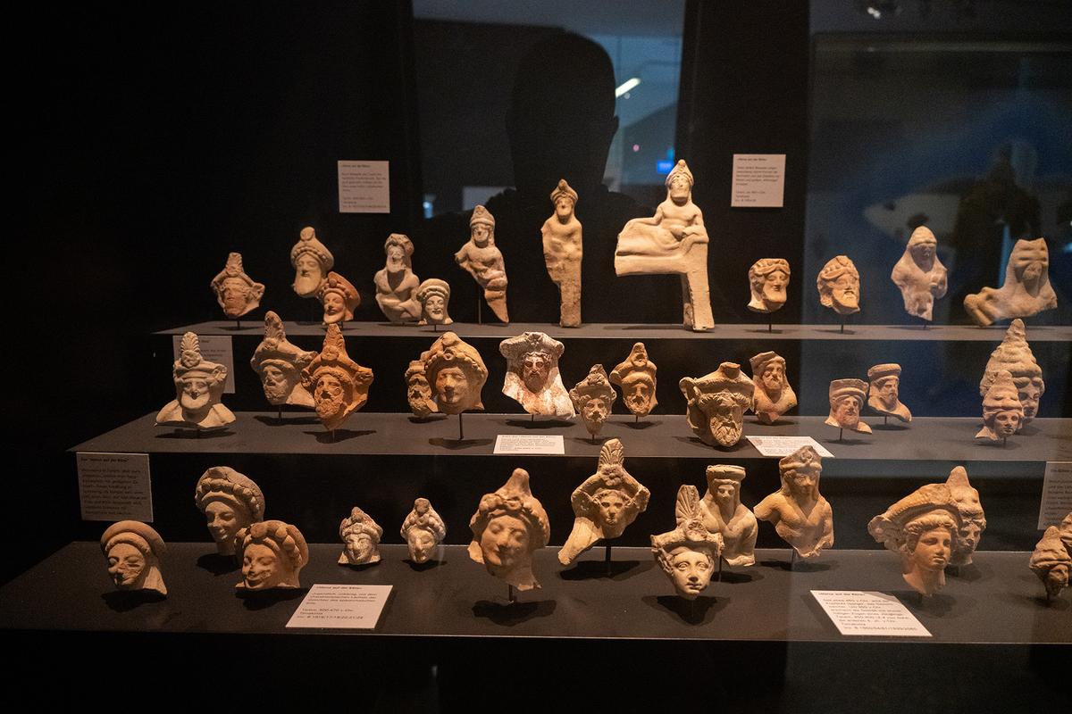 Ancient terracotta head fragments and figurines displayed in a museum gallery at Karlsruhe Palace in Karlsruhe, Baden-Württemberg, Germany. (Joseph Creamer/Shutterstock)