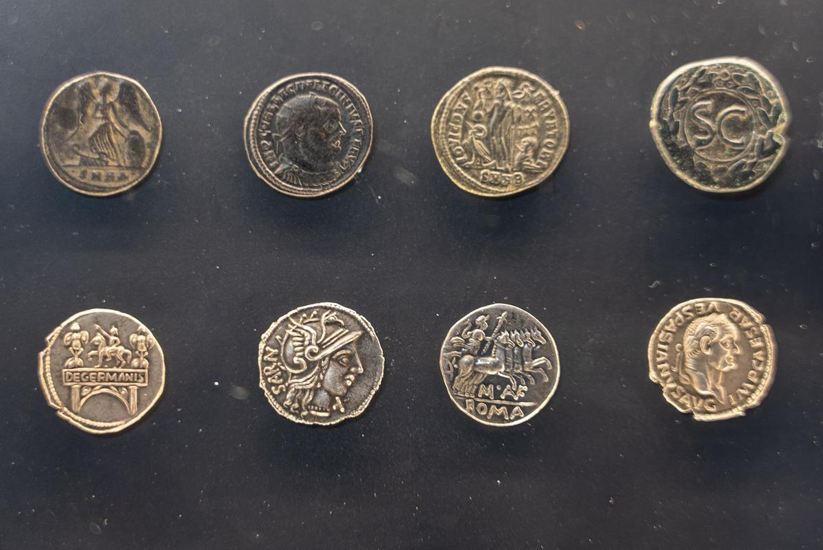 Historic coins frequently feature rulers, gods, and political symbols. These engravings help historians determine the coin's age and origin and offer insight into the priorities of past civilizations. (Wirestock Creators/Shutterstock)