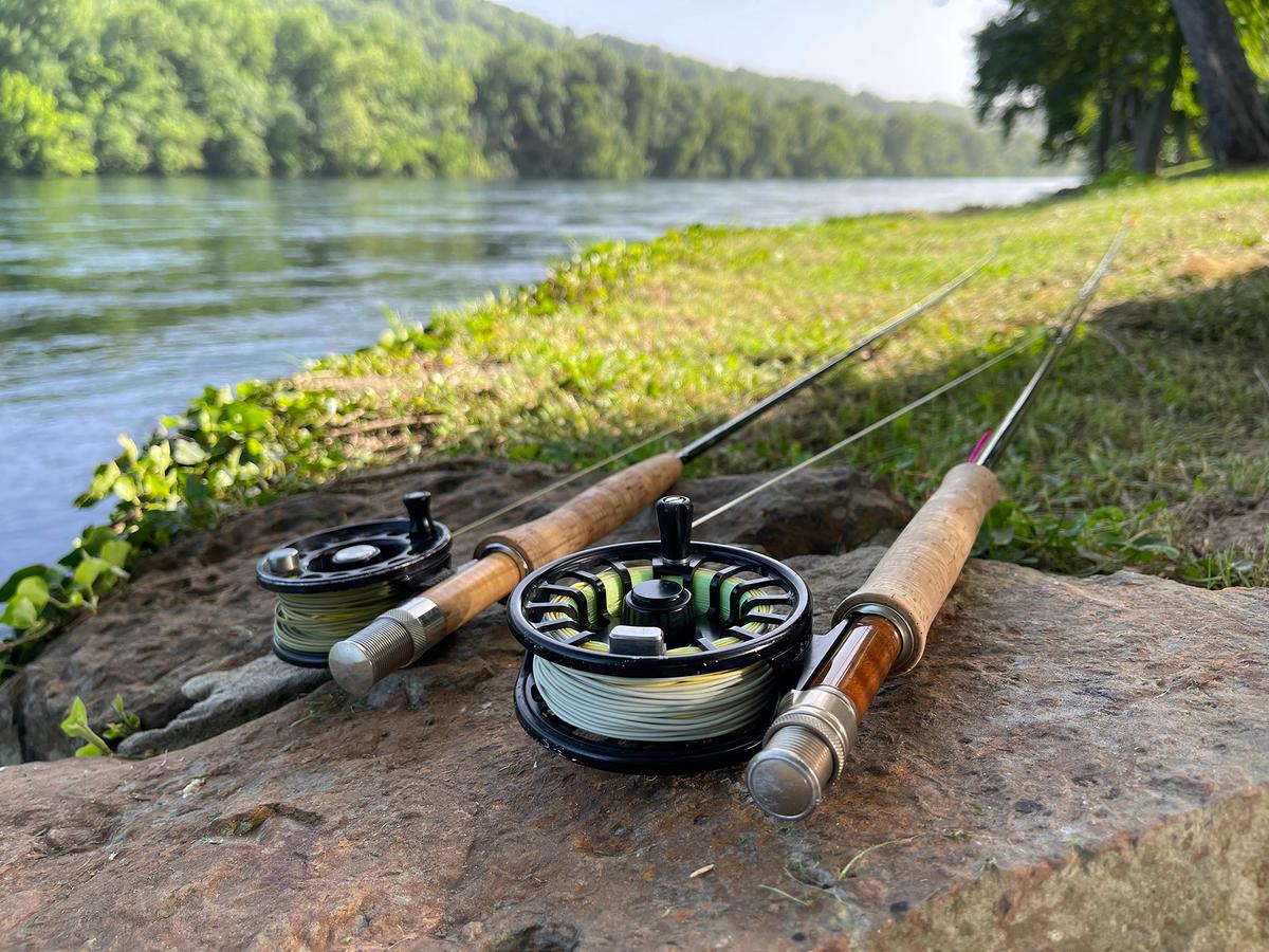 Tools of the trade: Fly rods resting on the bank are ready for the next cast. (CactusPilot/Shutterstock)
