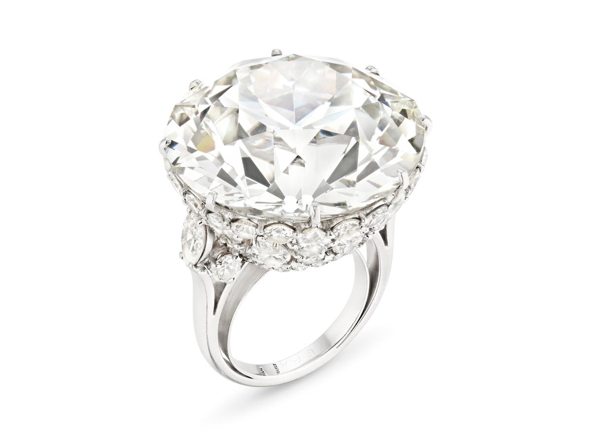 "Tugboat Diamond," circa 1970. Very light green-yellow old European brilliant-cut diamond of 49.91 carats, marquise and round diamonds, platinum; measures as US ring size 6 3/4, however, due to sizer fits as U.S. ring size 4 3/4. (Christie's)