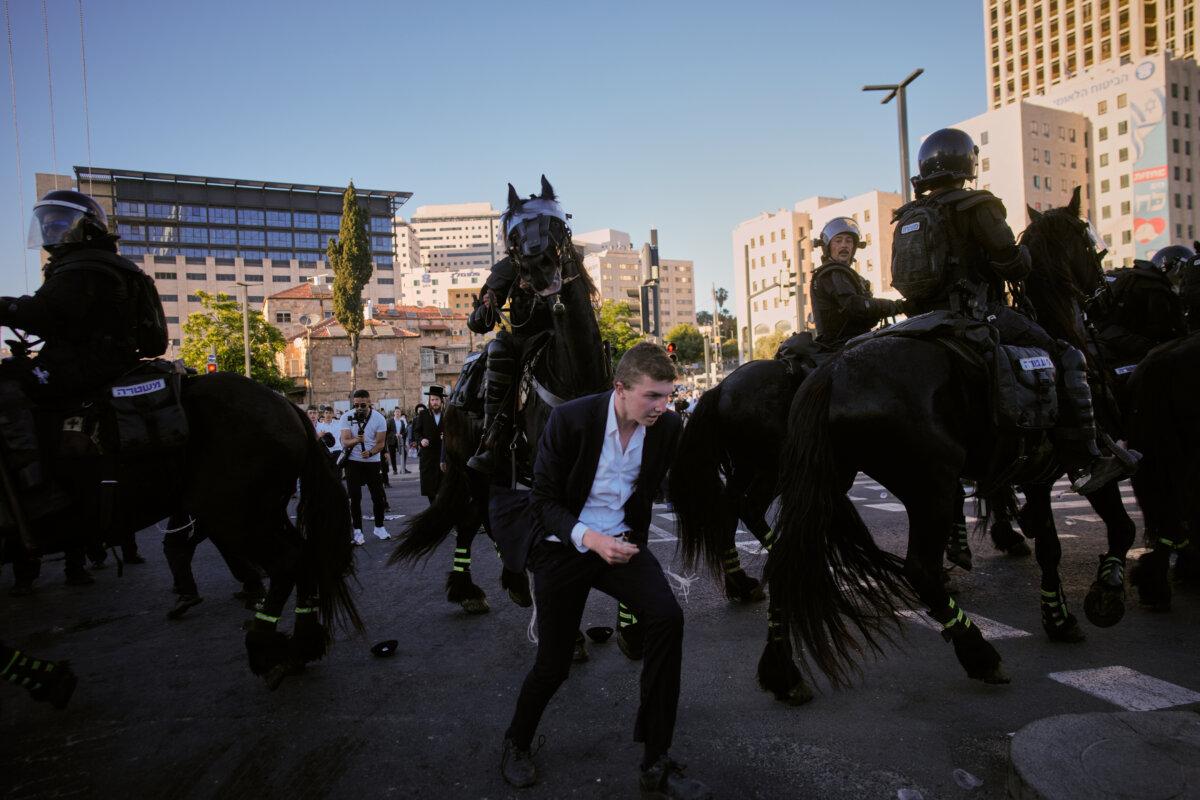 Israeli-mounted police disperse Ultra-Orthodox Jews blocking a road during a protest against army draft in Jerusalem, Israel, on June 1, 2026. (Ohad Zwigenberg/AP)