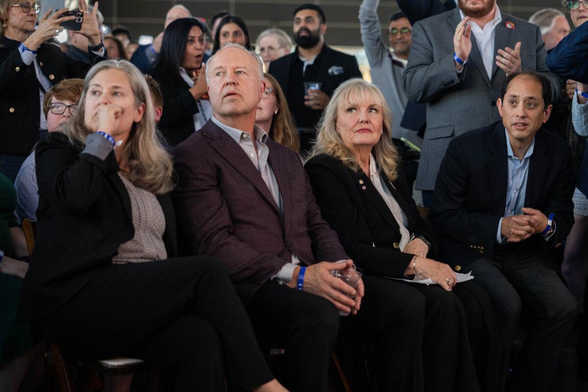 B.C. Conservative Party leadership candidate Kerry-Lynne Findlay and her husband, MLA Brent Chapman (L), watch as the final voting results are announced during leadership election night, in Vancouver, on May 30, 2026. (The Canadian Press/Ethan Cairns)