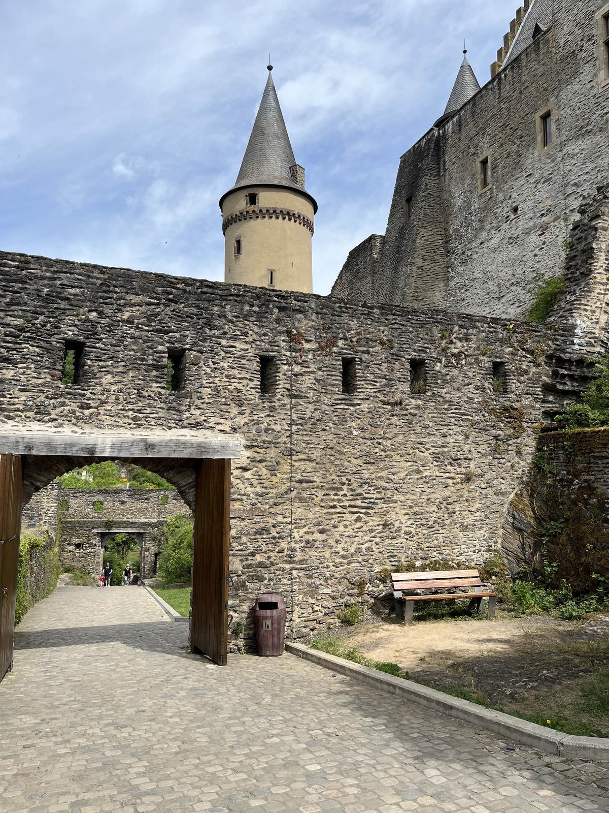 Beneath the conical roof of Vianden Castle’s main tower is what is called a stringcourse, or decorative band. It's a common Renaissance accent. The castle was once accessible by four gates, including this one. Numerous arrow slits, openings  to see out or shoot from, are built into the carefully stacked stone of the castle. (Samuel Geisler/Shutterstock)