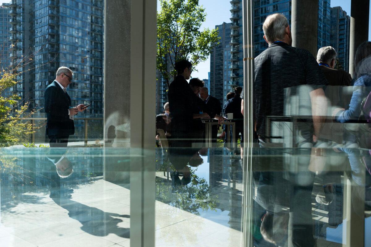 People socialize ahead of a B.C. Conservative Party leadership debate at the Canada Strong and Free Network conference in Vancouver on April 24, 2026. (The Canadian Press/Chad Hipolito)