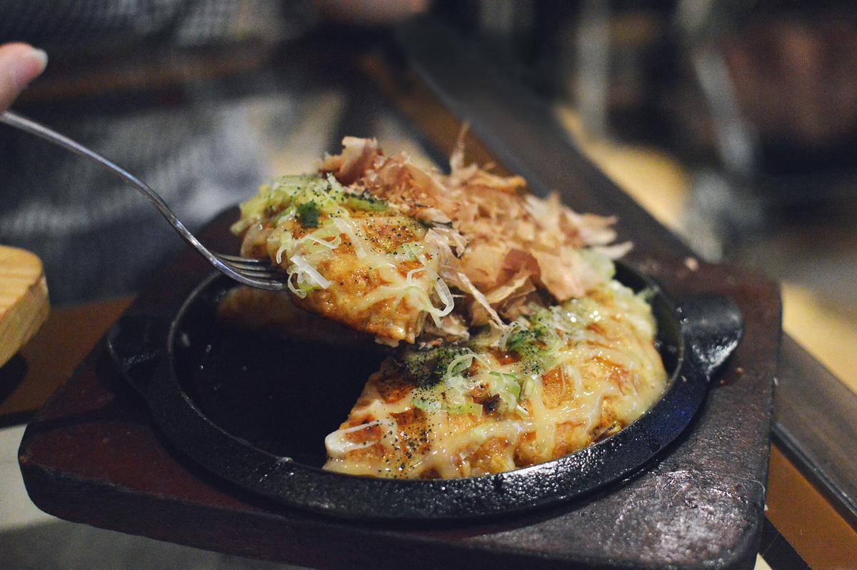 Unlike the Osaka version, the Hiroshima-style okonomiyaki is layered rather than mixed together. It's cooked on a flat griddle and topped with a savory sauce. (Irina Marwan/Getty Images)
