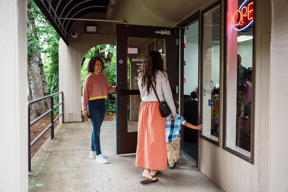 Holding a door open for others is a simple gesture of consideration that remains a hallmark of good manners. (Fly View Productions/Getty Images)