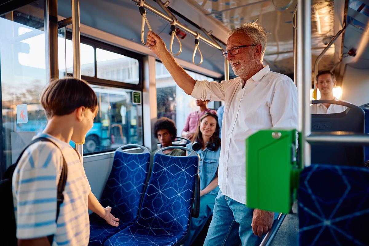 Giving up a seat for someone is one example of the everyday courtesy that many Americans associate with good manners. (Igor Suka/Getty Images)