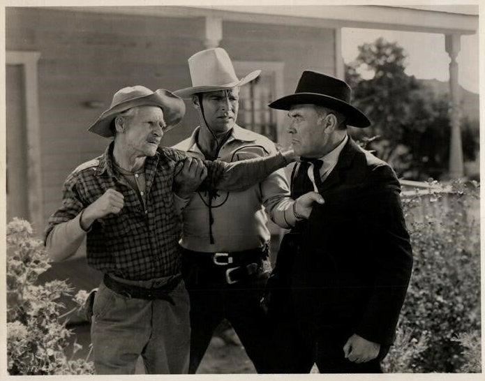 (L–R) Fuzzy Jones (Al St. John), Billy Carson (Buster Crabbe), and Cliff Walters (Hal Price), in “Wild Horse Phantom.” (GJW+)