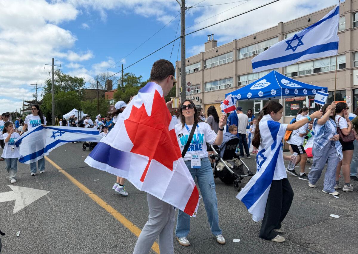 People participate in the United Jewish Appeal's annual Walk With Israel march in Toronto on June 7, 2026. (The Canadian Press/Sandra Ezekwesili)