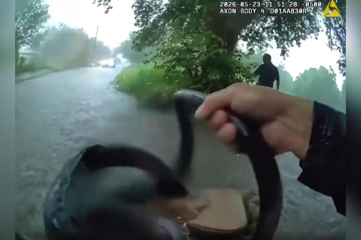 Bodycam footage shows Patrolman Matthew Puente rescuing an infant from a sedan that was being swept off course by a flash flood in Beeville, Texas. (Beeville Police Department)