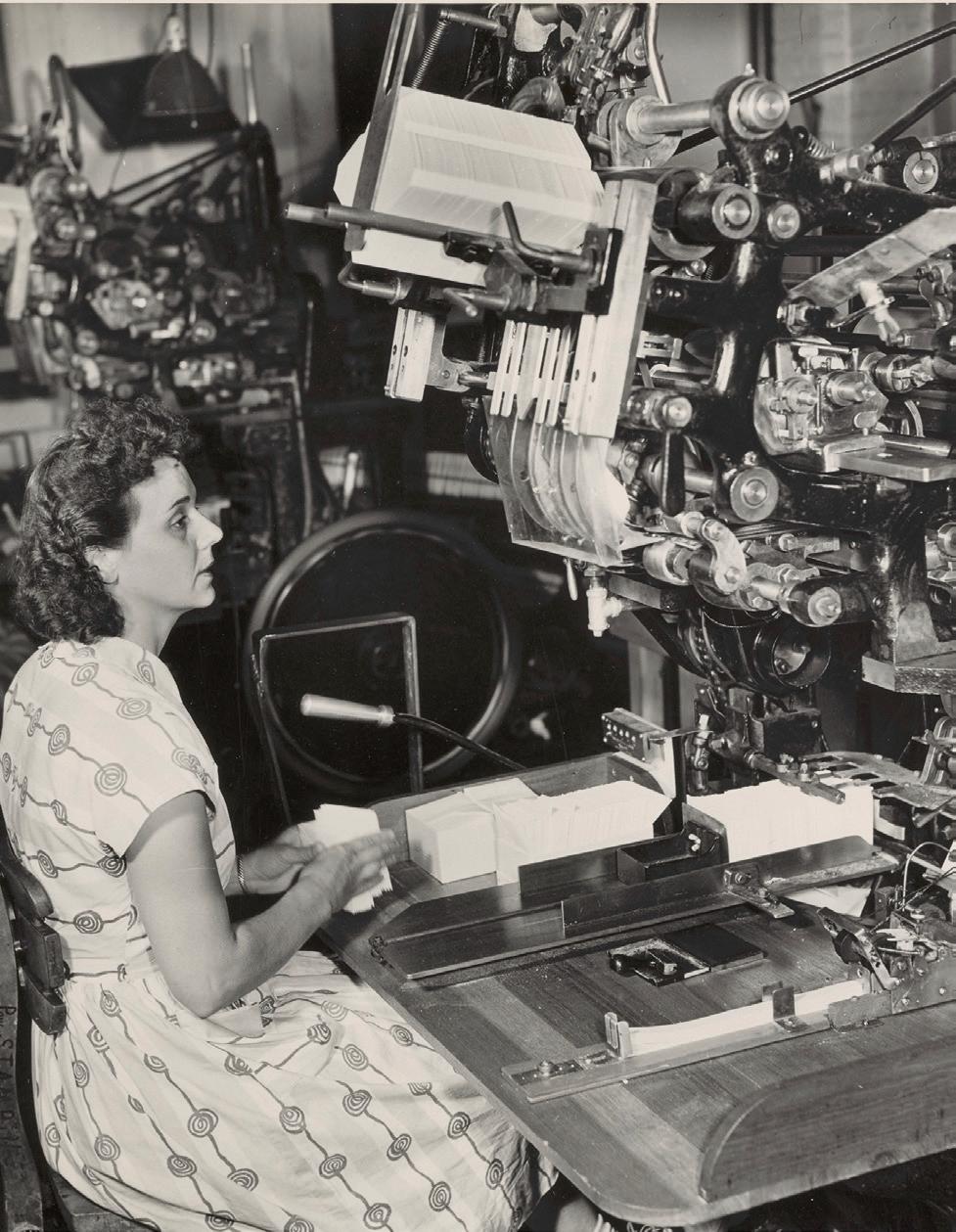 A woman operates an envelope machine for Crane. (Crane Museum of Papermaking and Center for the Paper Arts)