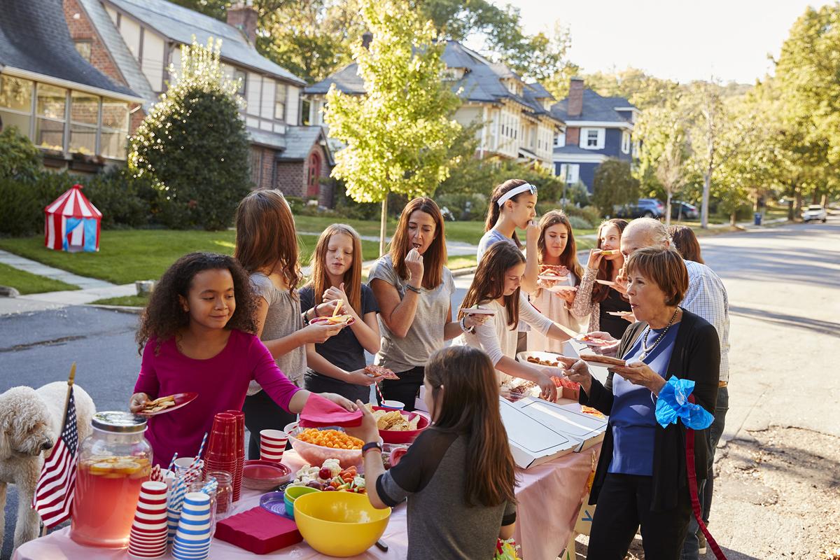 Neighborhood gatherings help families build familiarity and trust, making it easier for children to develop friendships close to home. (monkeybusinessimages/Getty Images)