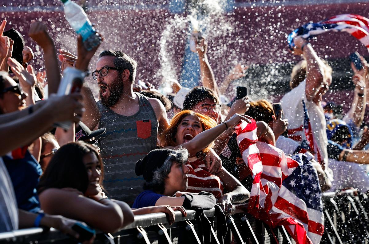 U.S. fans cheer after the United States scored its first goal in its World Cup match against Paraguay while watching the match at the FIFA Fan Festival at LA Memorial Coliseum in Los Angeles on June 12, 2026. (Mario Tama/Getty Images)