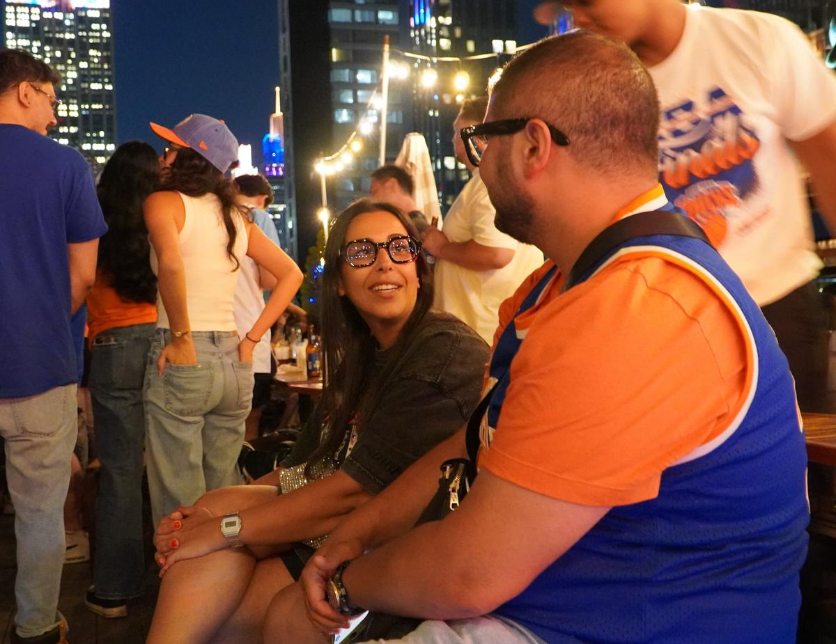Visitors from France Ibrahim Dellaoui and Fatira Chabet-dis came to see France play in the World Cup; they got caught up in the excitement of the Knicks’ win, June 13, 2026. (Nicholas Zifcak/The Epoch Times)