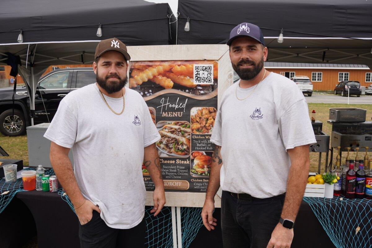 Brothers Robert (L) and Billy (R) Alvarez outside their stall at the America the Beautiful festival in Port Jervis, N.Y., on June 14, 2026. (Oliver Mantyk/The Epoch Times)