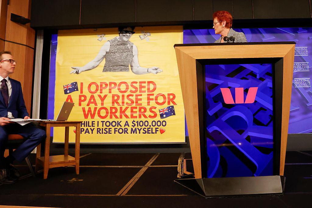 A screen descends behind One Nation Leader Senator Pauline Hanson at the National Press Club in Canberra, Australia on June 17, 2026. (Hilary Wardhaugh/Getty Images)