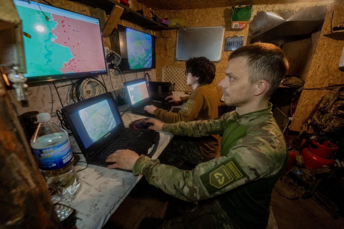 Ukrainian servicemen of the Khartia Brigade check the drone's aerial view in the command center of the Kharkiv region, Ukraine, on May 20, 2026. (AP Photo/Andrii Marienko)