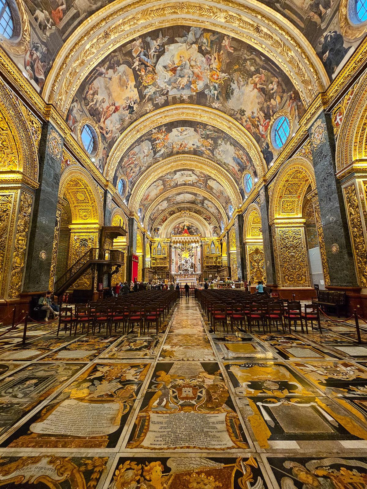 The nave was decorated by Mattia Preti, whose paintings of scenes from the life of John the Baptist adorn the vaulted ceiling. Equally remarkable is the floor, composed of nearly 400 inlaid polychrome marble ledger stones marking the graves of knights and officers. Their coats of arms and heraldic imagery combine to create one of Europe’s most elaborate and visually striking funerary floors. (Sujin Krishnan/Shutterstock)
