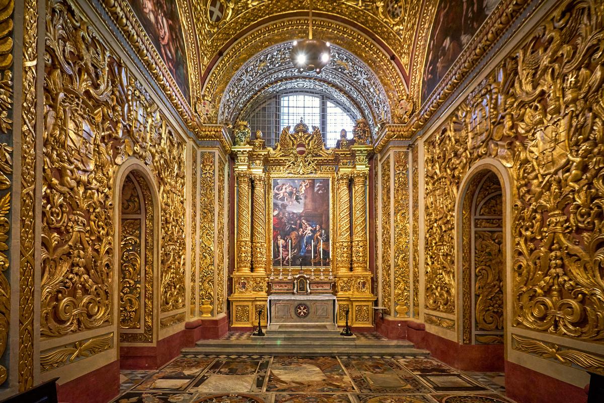 Dedicated to the Epiphany of Christ, the Chapel of the Langue of Germany is the only chapel in the cathedral without a Grand Master’s funerary monument. Its devotional focus is expressed in the central altarpiece, "The Adoration of the Magi," by the 17th-centyry Maltese artist Stefano Erardi, and in carved heraldic stonework featuring the double-headed eagle of the German Langue. Originally assigned to the English Langue, it passed to the Germans after the Reformation. (Vladimir Zhoga/Shutterstock)