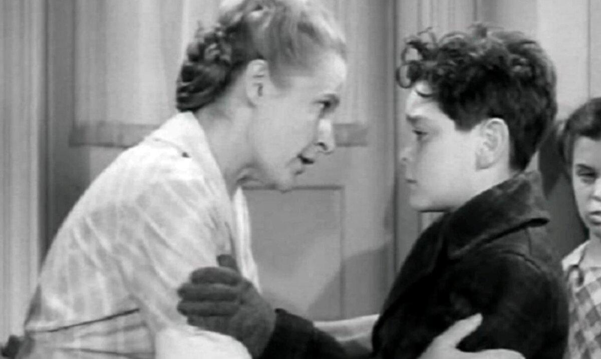 Alleta Sullivan (Selena Royle) comforts her son, George (Buddy Swan), in “The Fighting Sullivans.” (GJW+)