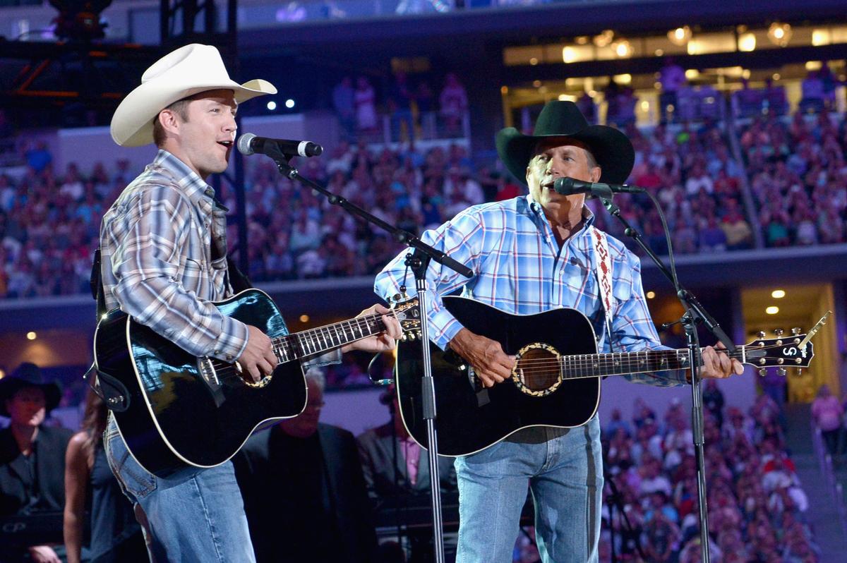 Bubba Strait (Left) and George Strait perform onstage at George Strait's "The Cowboy Rides Away Tour" final stop on June 7, 2014 in Arlington, Texas. (Rick Diamond/Getty Images)