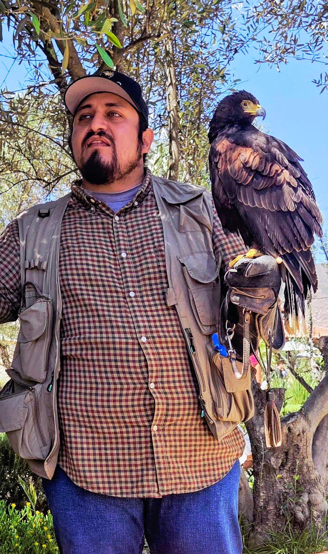 Master falconer Carlos Laorrabaquio, here shown with Cassiopea, trains birds to keep rodents away from the vineyards at El Cielo Resort and Winery in northern Baja California, Mexico. (Photo courtesy of Jim Farber)