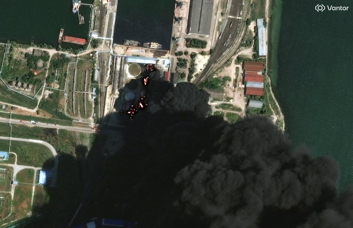 A satellite image shows fire and smoke rising from oil tanks, after what Ukrainian President Volodymyr Zelenskyy said was an attack on an oil depot in the city of Kerch, Crimea, on June 21, 2026. (Vantor/Handout via Reuters)