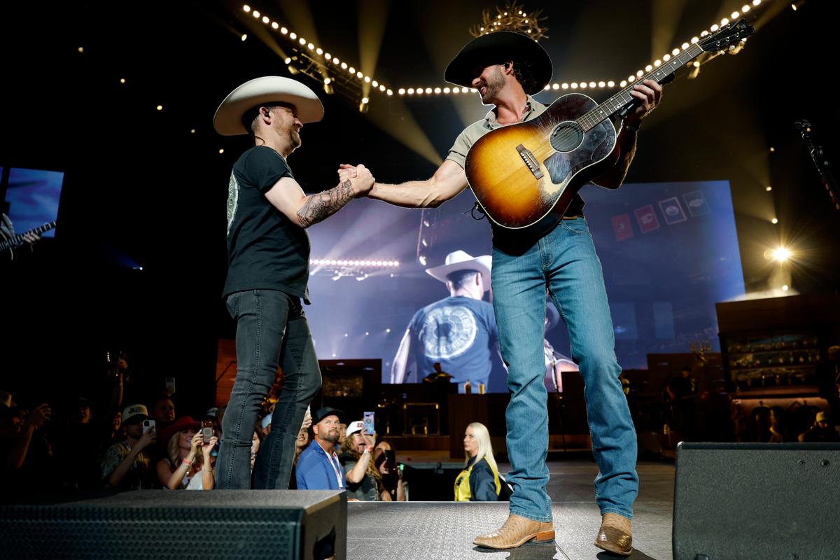 Justin Moore (L) and Riley Green perform onstage for the "Cowboy As It Gets" tour at Bridgestone Arena in Nashville on April 18, 2026. (Jason Kempin/Getty Images)
