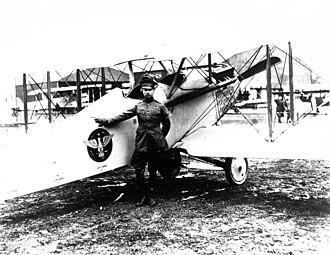Mitchell posing with his Vought VE-7 Bluebird aircraft at the Bolling Field Air Tournament in Washington, D.C., 1920. (Public Domain)
