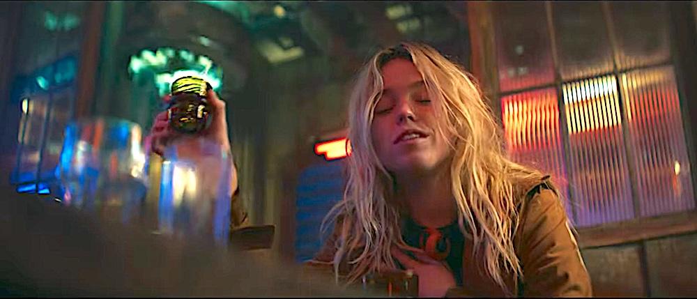 Supergirl (Milly Alcock) enjoying the effects of a particularly potent drink, in "Supergirl." (Warner Bros. Pictures)