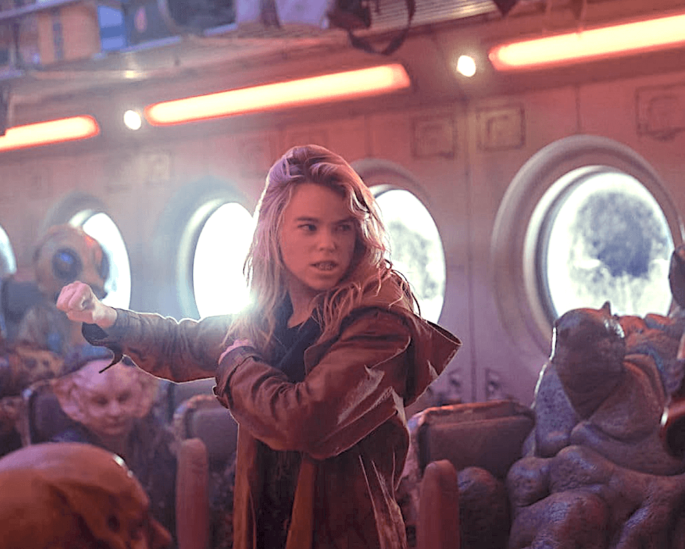 Supergirl (Milly Alcock) is not going to allow herself to be ripped off on the space bus, in "Supergirl." (Warner Bros. Pictures)