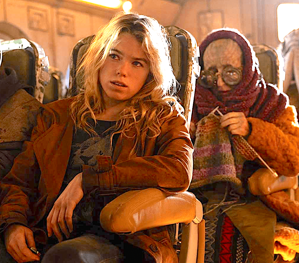 Supergirl (Milly Alcock), on the space bus, sees trouble brewing, in "Supergirl." (Warner Bros. Pictures)