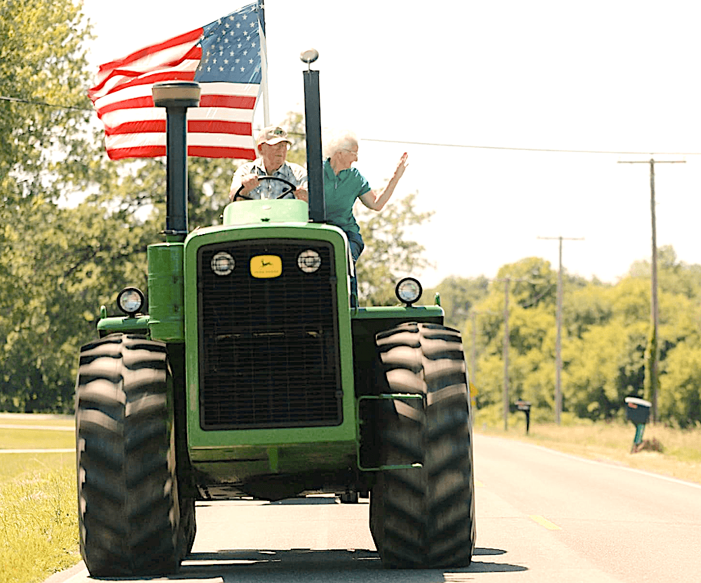 The local tractor club comes rolling in for the Flag Day parade, in "Flag Day." (Shea Productions)